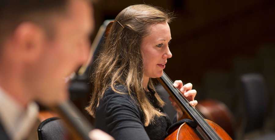 RPO Player Anna Stuart playing the cello in concert.
