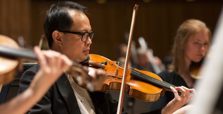 RPO player Chian Lim playing the viola in concert.