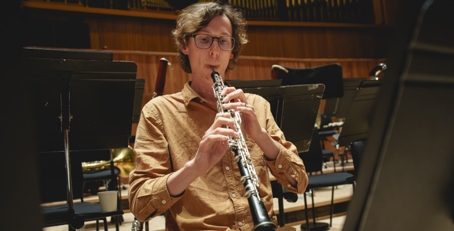 RPO Player John Roberts playing the oboe in rehearsal.