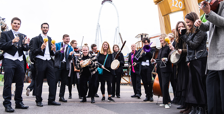 an image showing RPO musicians outside with members of the public