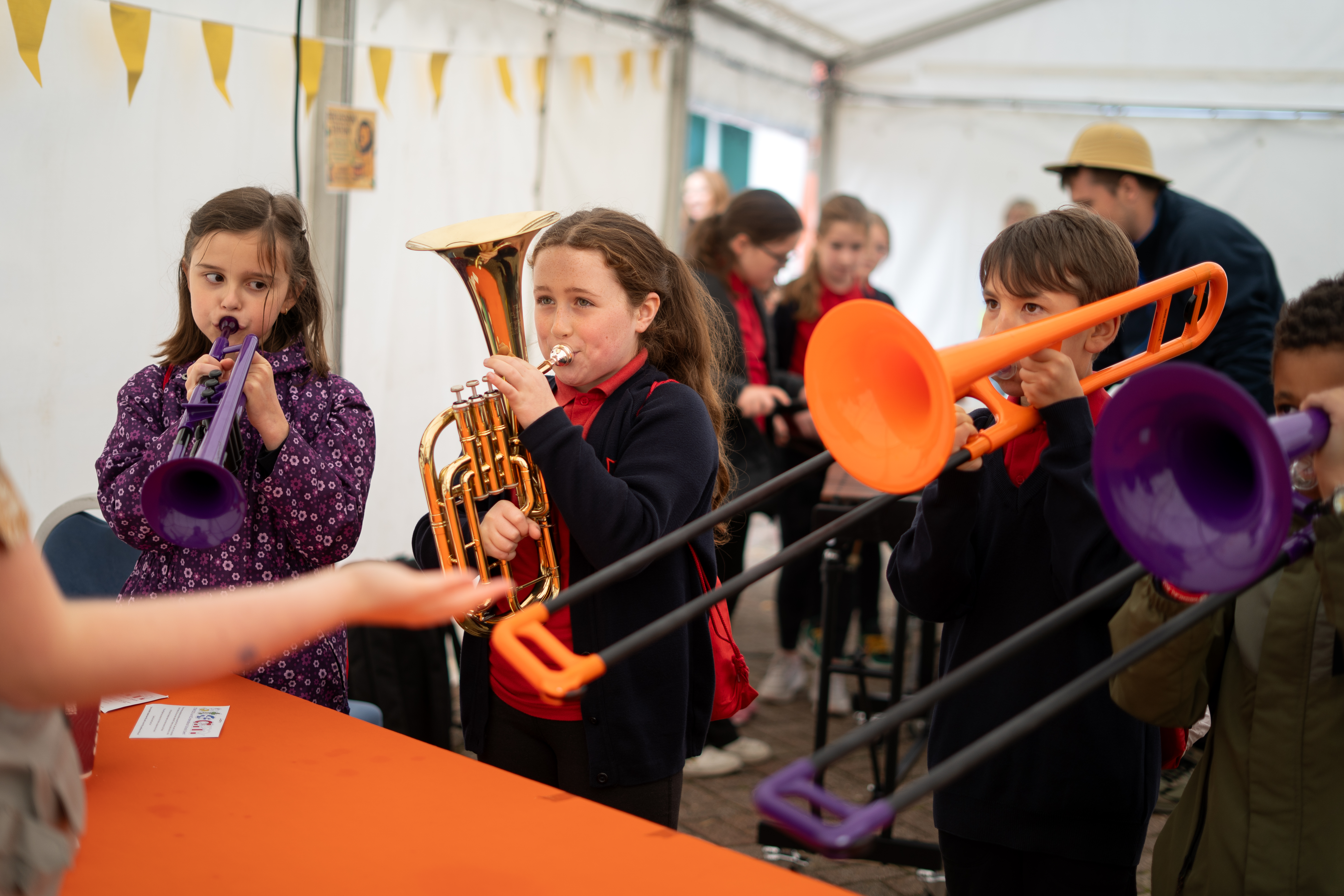 Participants playing trombones
