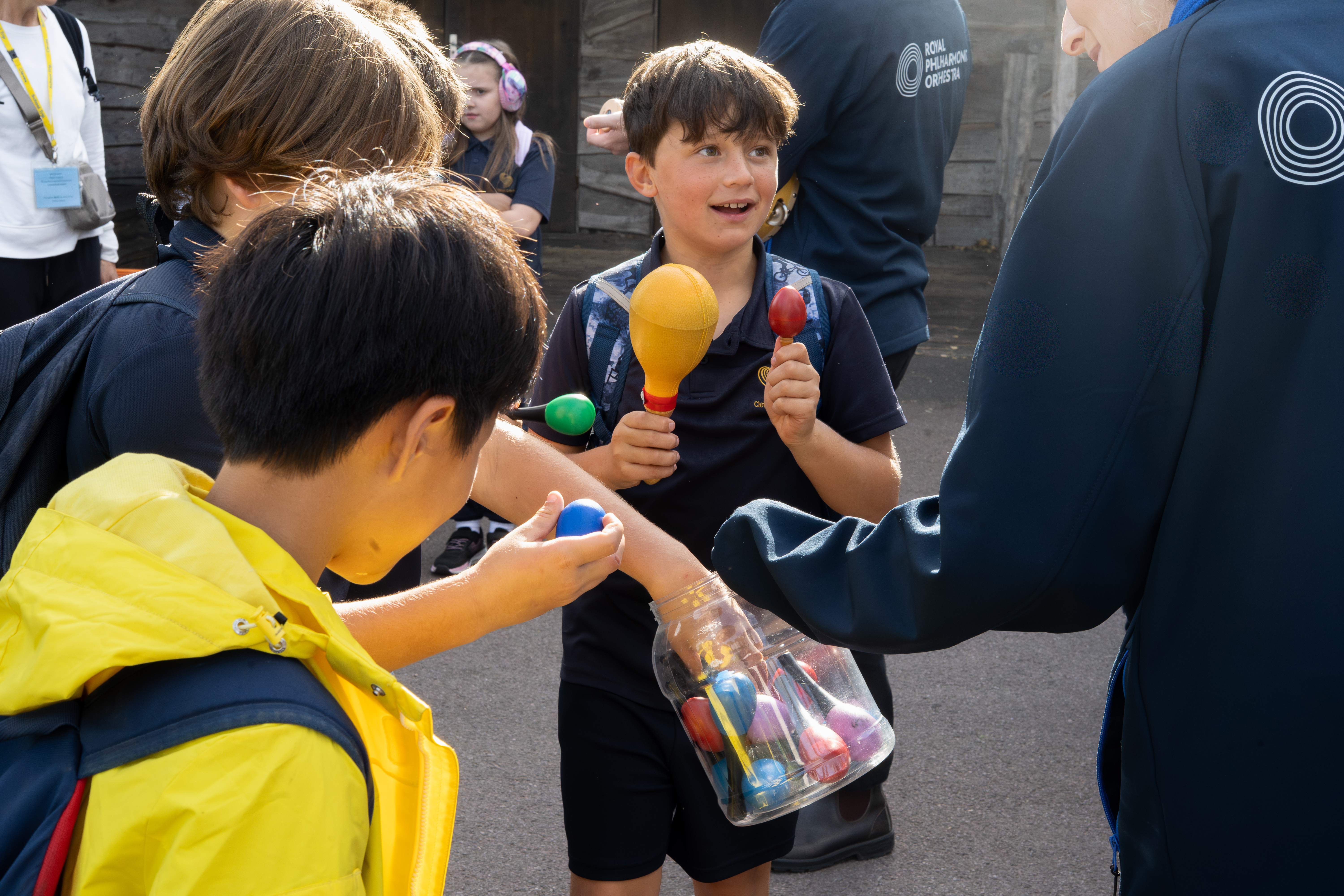 Participants being handed maracas by the RPO Resound team