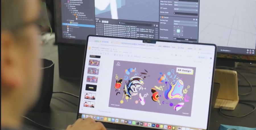 A computer screen showing the AR design for The Colours of Music can be seen