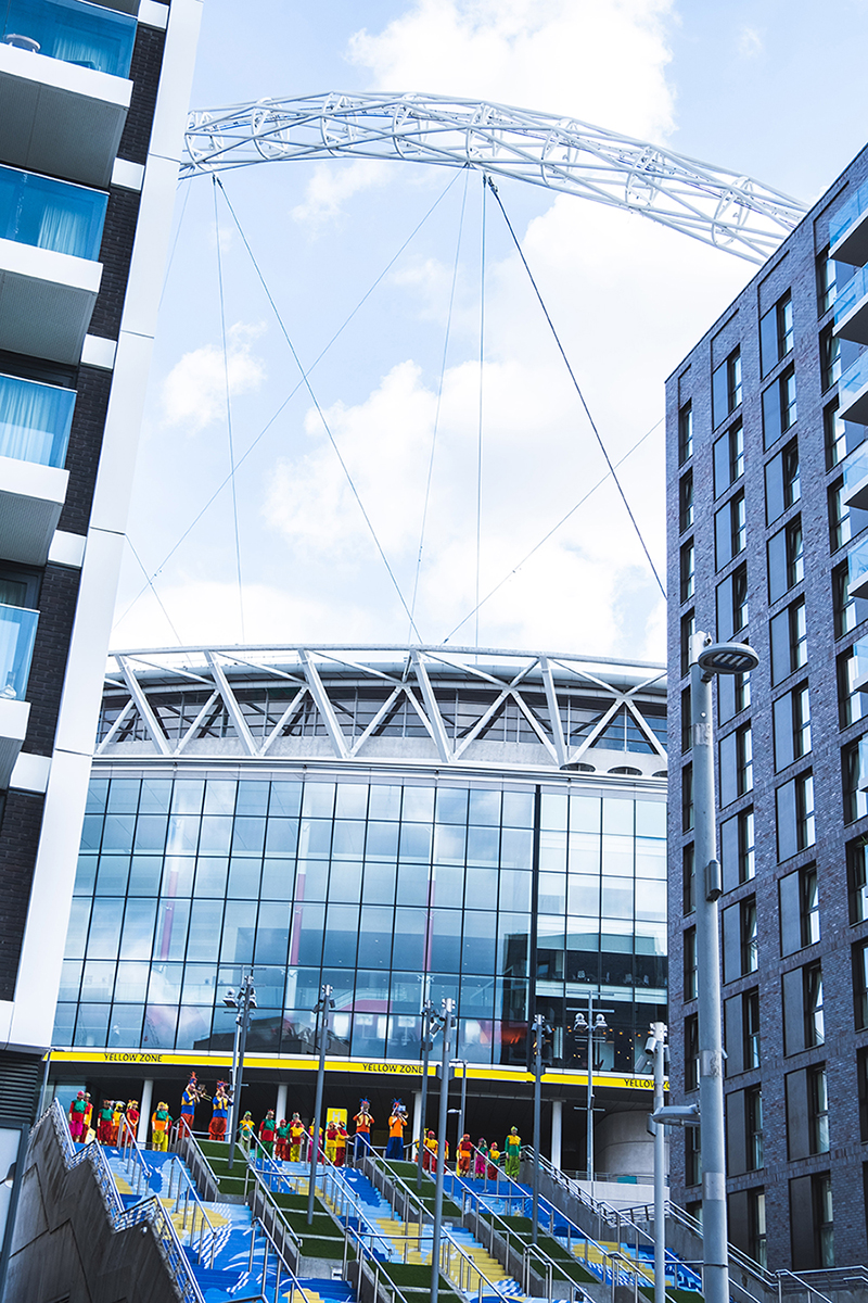 An image of Brent Youth Theatre + Mahogany Carnival Arts outside Wembley Stadium