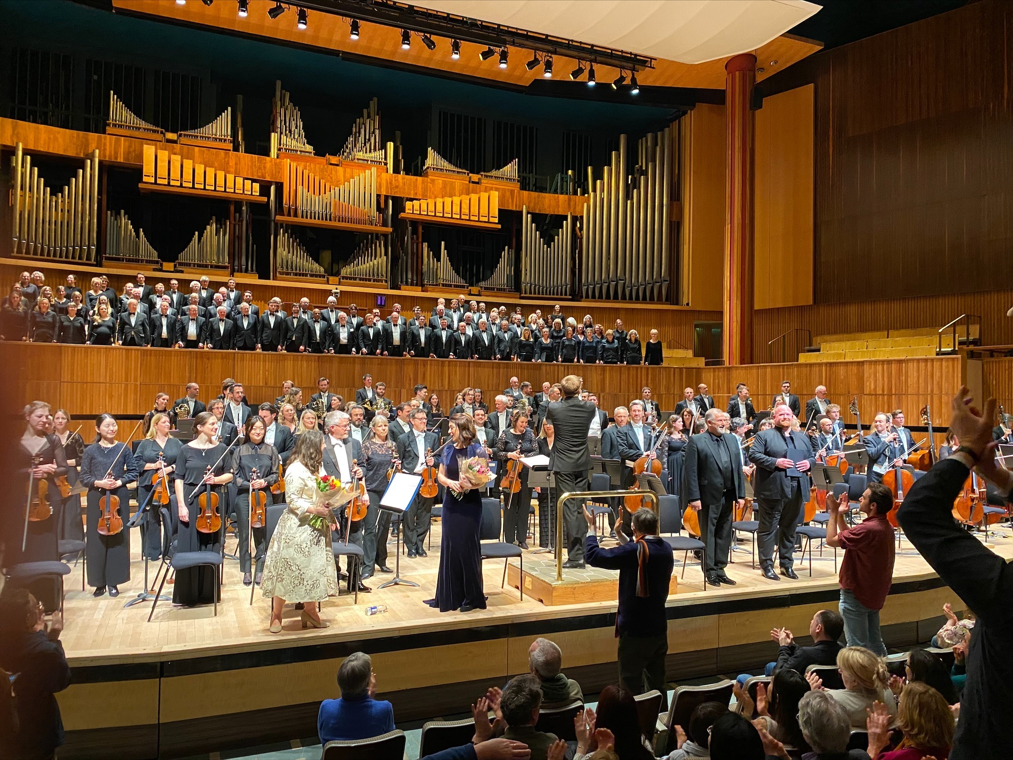 The RPO and Philharmonia Chorus reciving applause on stage at the Royal Festival Hall.