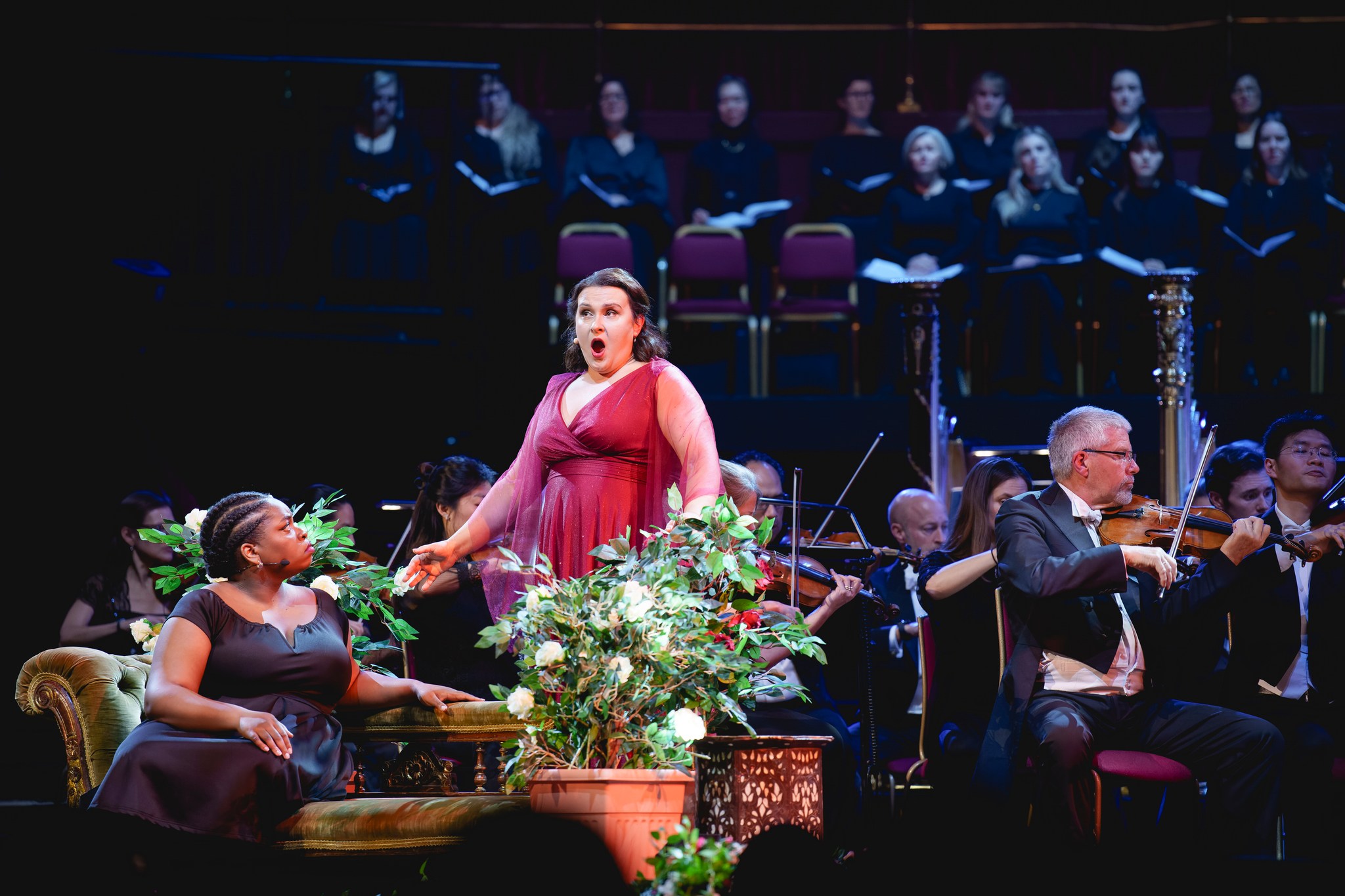 Maria Motolygina singing as Iolanta in a red dress on stage at the Royal Albert Hall
