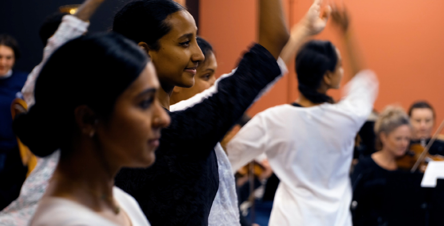 Indian Kathak dancers with Orchestra players in the background