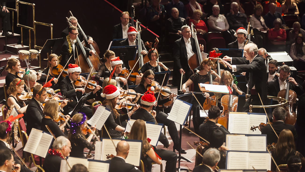 An image of John Rutter conducting at the Royal Albert Hall at Christmas time. Credit: Nick Rutter
