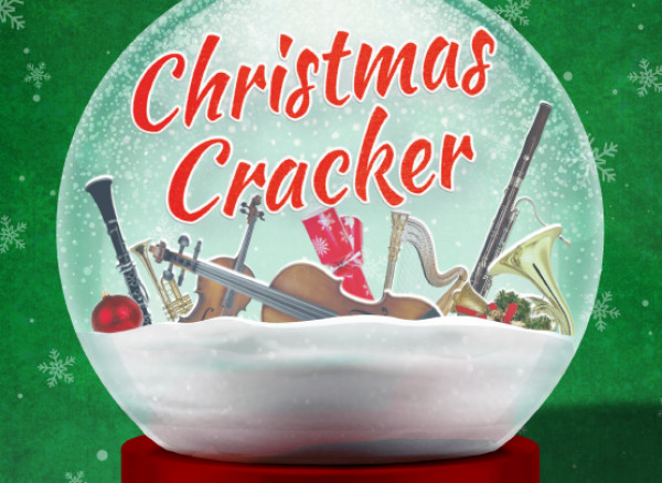 An image of a christmas snow globe, with 'Christmas Cracker' written in red text