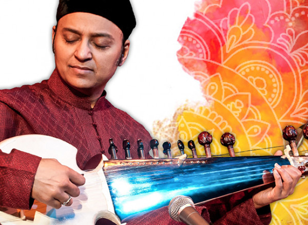 An image of Wajahat Khan playing a Sarod with a orange and pink design on the right side of the image