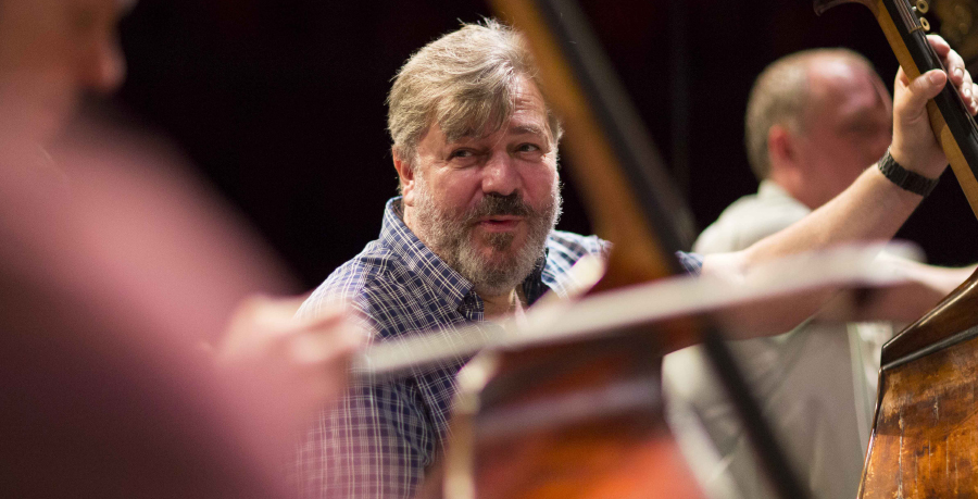 RPO Player David Gordon in rehearsal, holding his double bass.