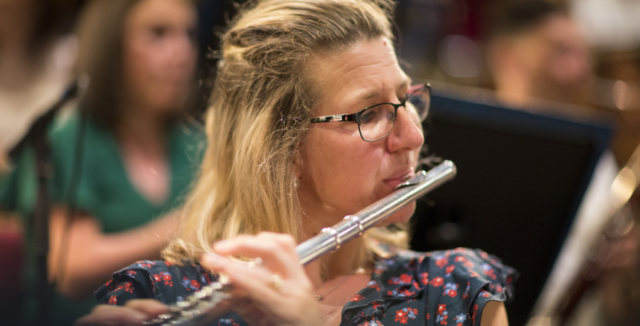 RPO Player Joanna Marsh playing the flute in rehearsal.