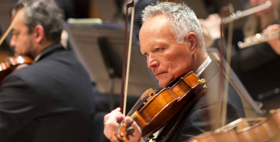 RPO Player Jonathan Hallett playing the viola in concert.