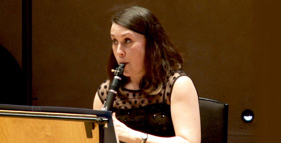 RPO Player Katherine Lacy playing the clarinet in concert.