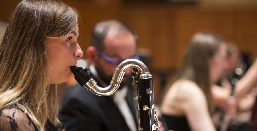 RPO Player Katy Ayling playing the bass clarinet in concert.