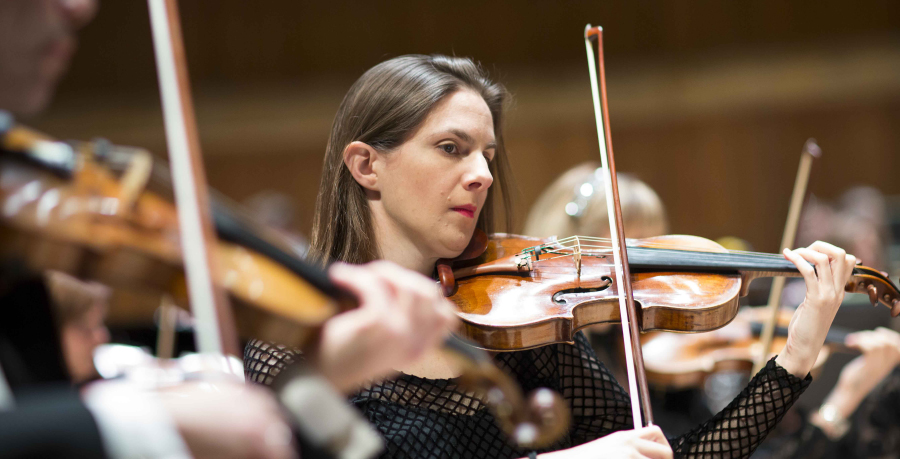 RPO Player Shana Douglas playing the violin in concert.
