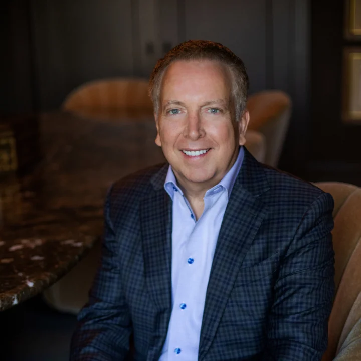 A seated headshot of AFRPO board member Brett Rousch