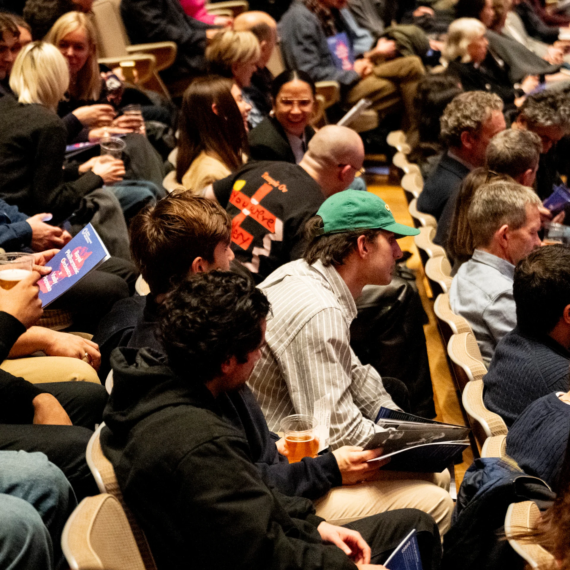 Audience members in the Royal Festival Hall just before a concert begins