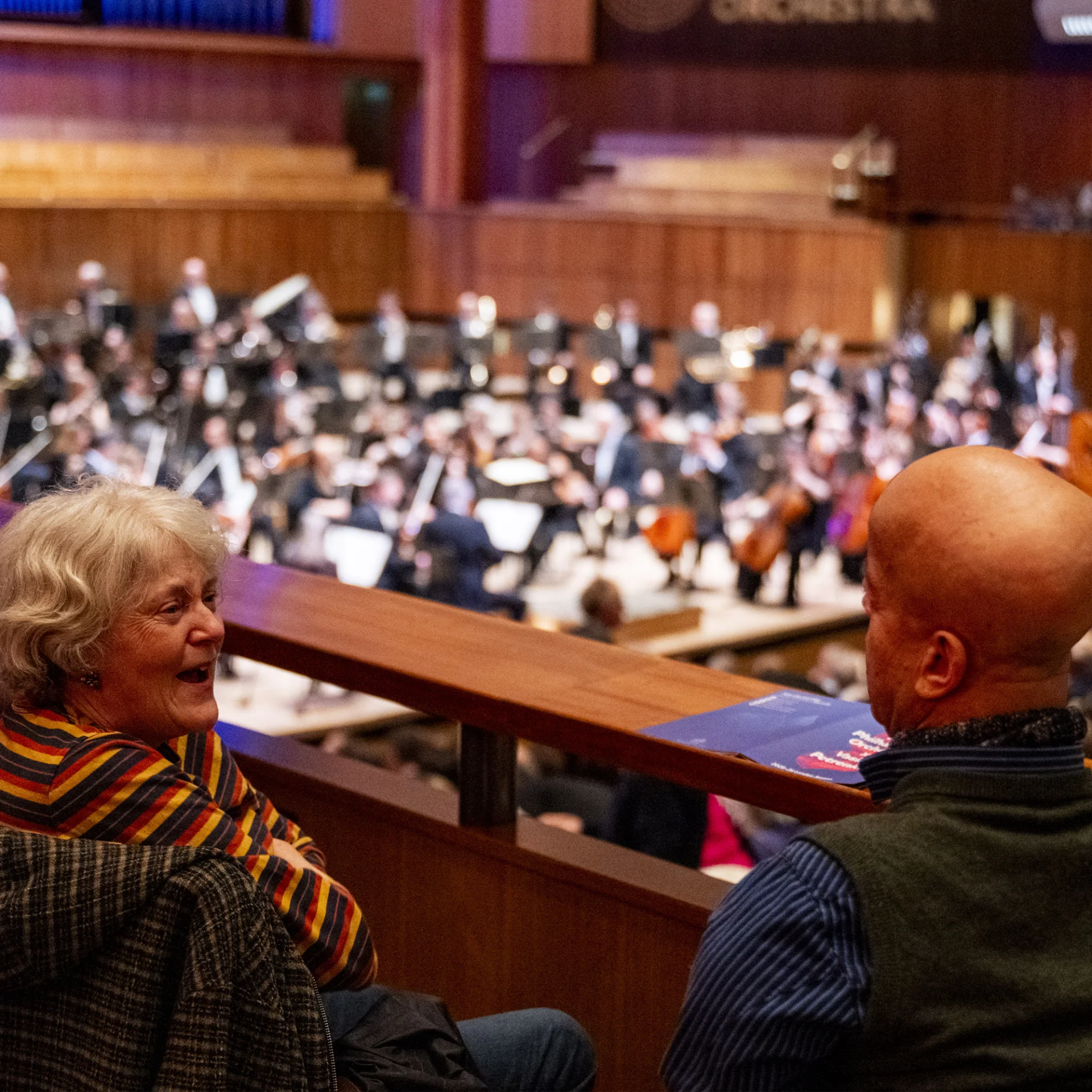 Audience members in the side stalls at the Royal Festival Hall