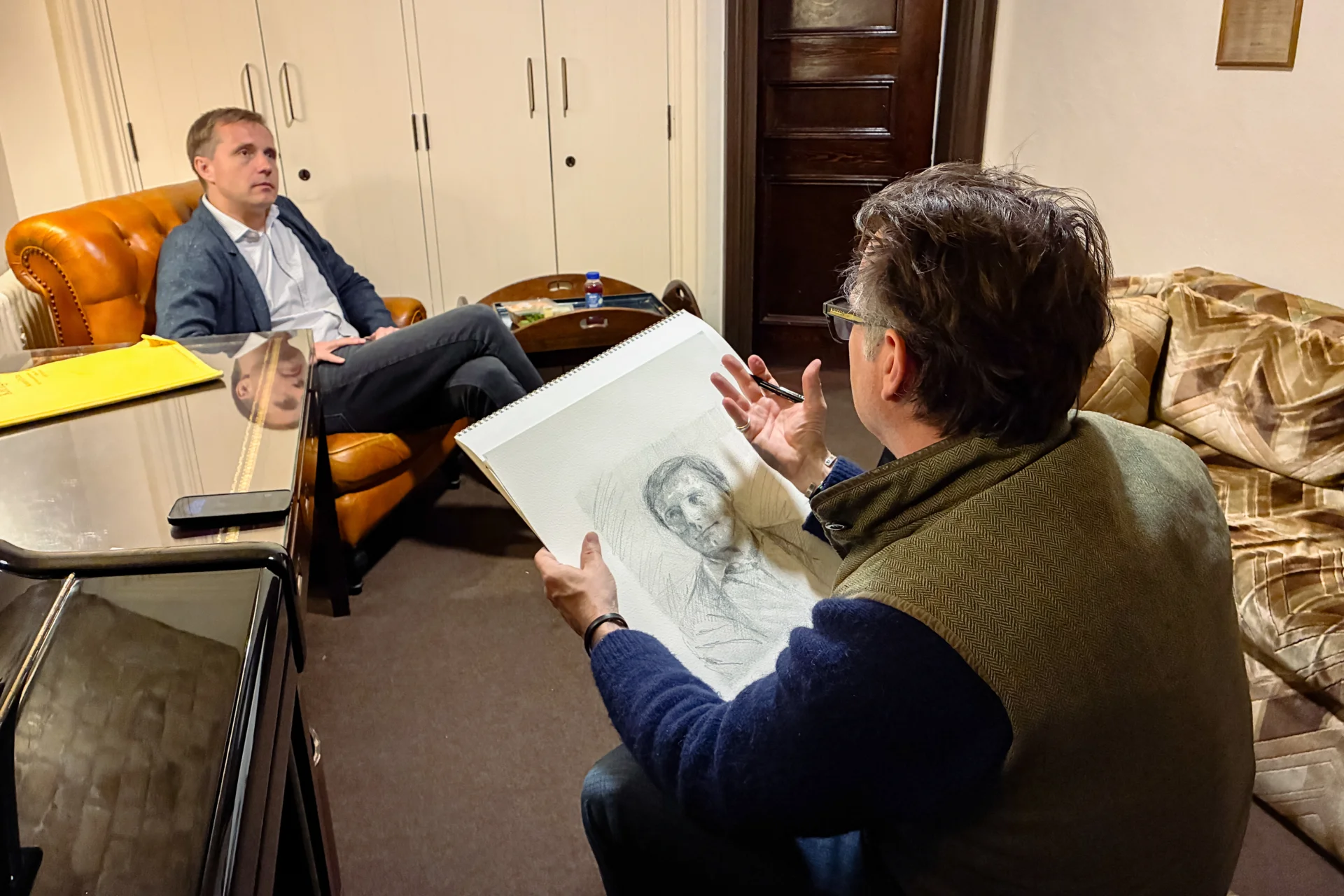 Jeremy Houghton sketching Vasily Petrenko in a dressing room