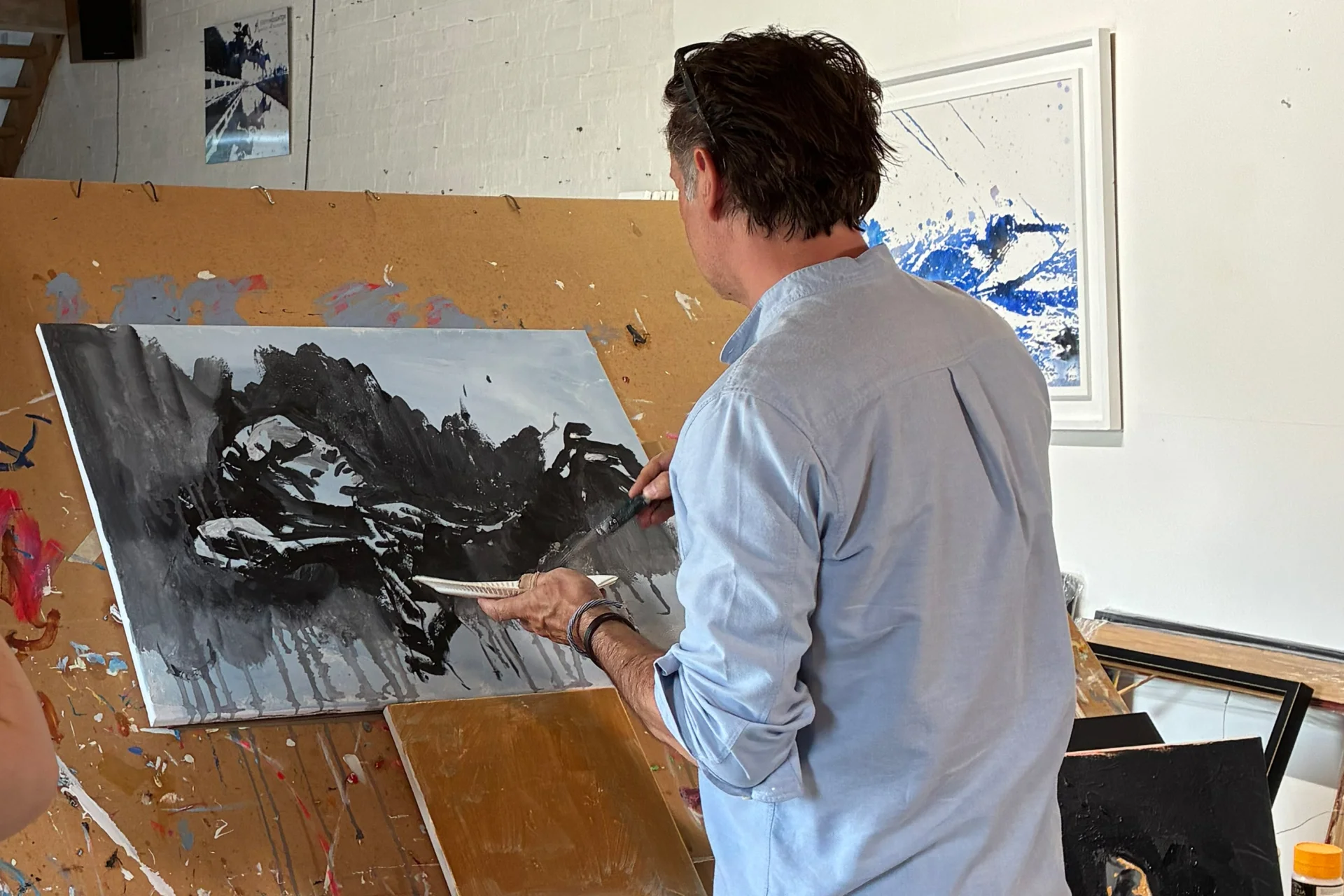 Jeremy painting an image of conductor Vasily Petrenko in his studio