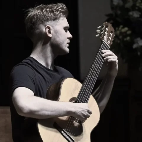 Jack Hancher plays guitar