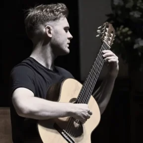 Jack Hancher plays guitar