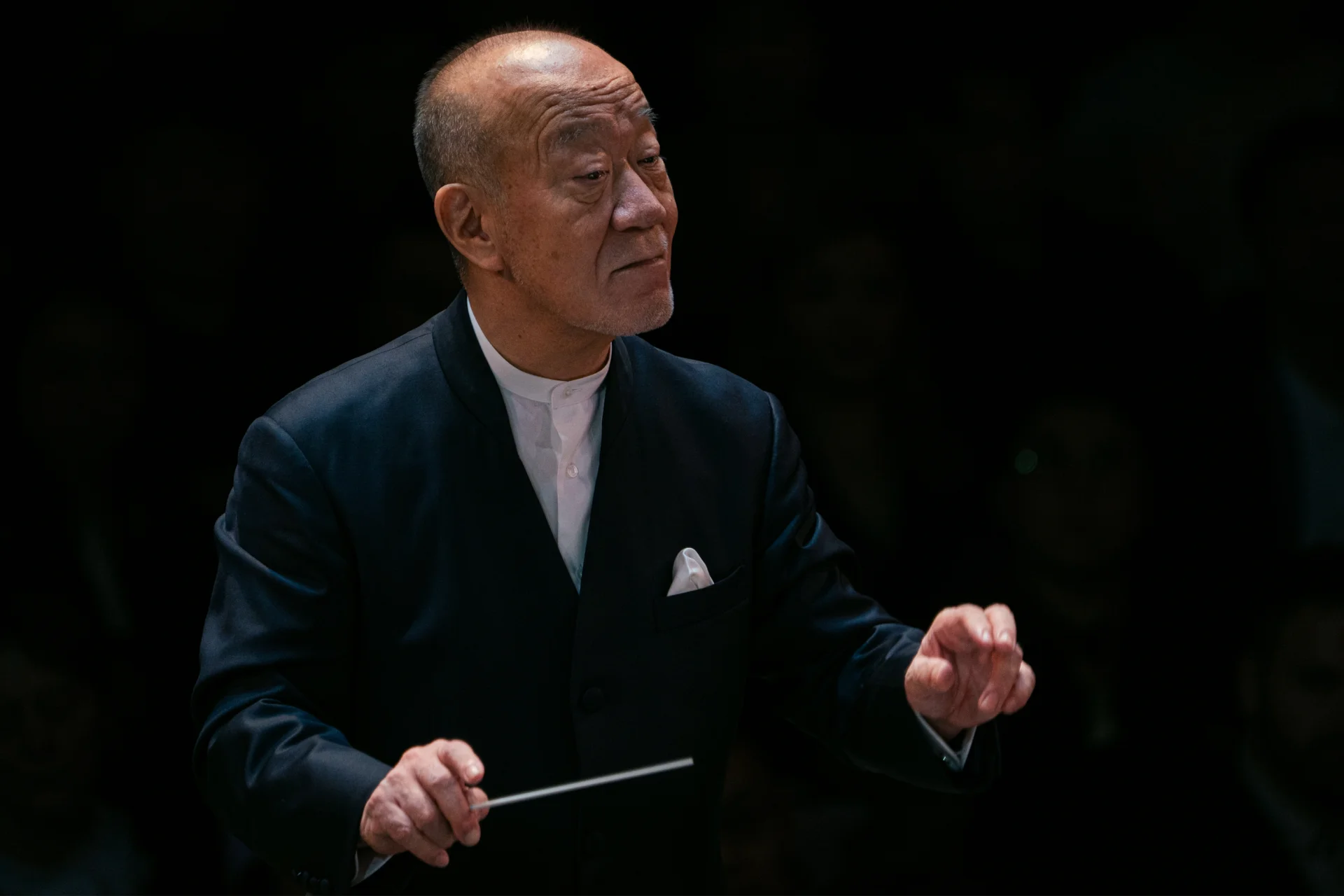 A photo of Joe Hisaish conducting