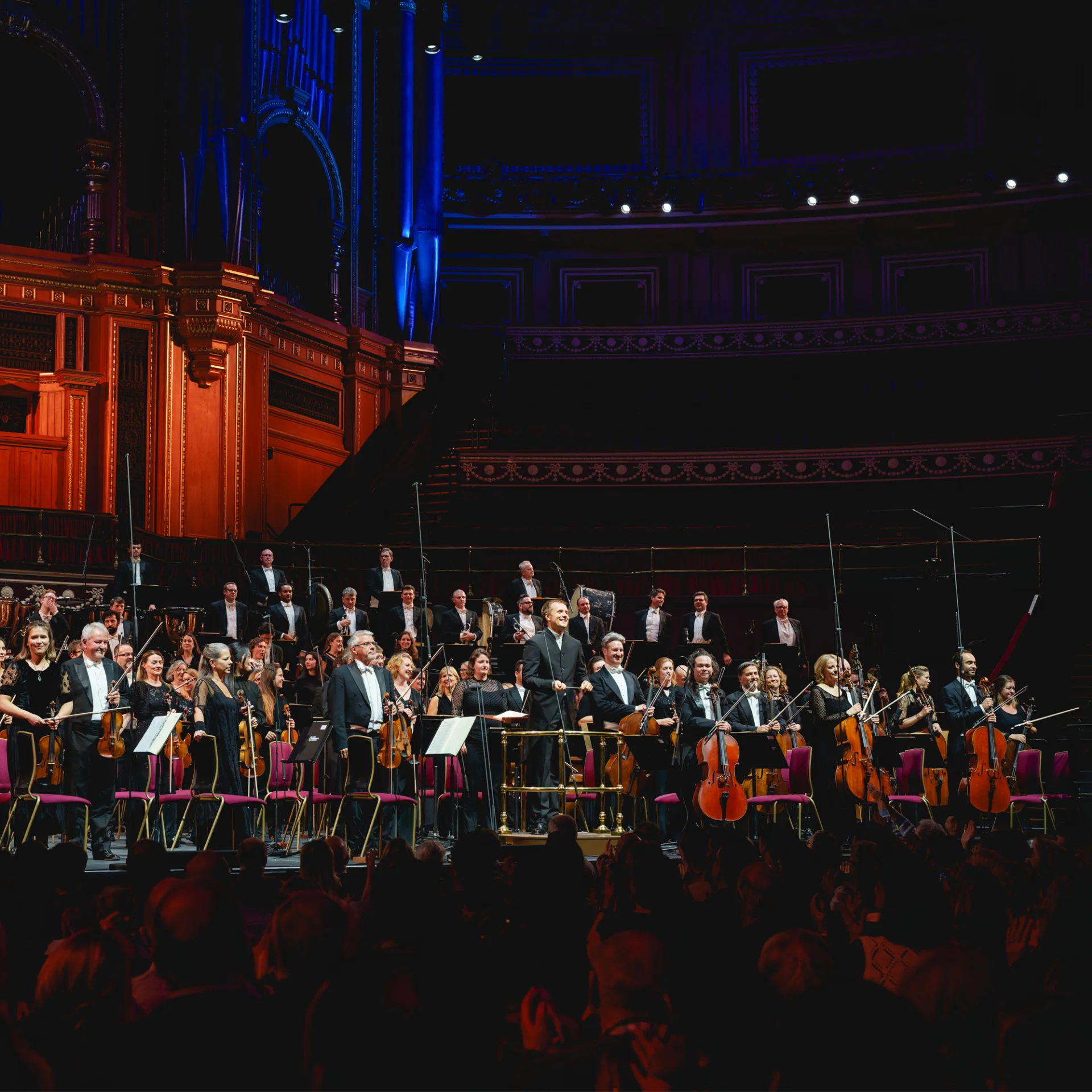 The RPO and Vasily Petrenko standing on stage at the Royal Albert Hall to receive applause