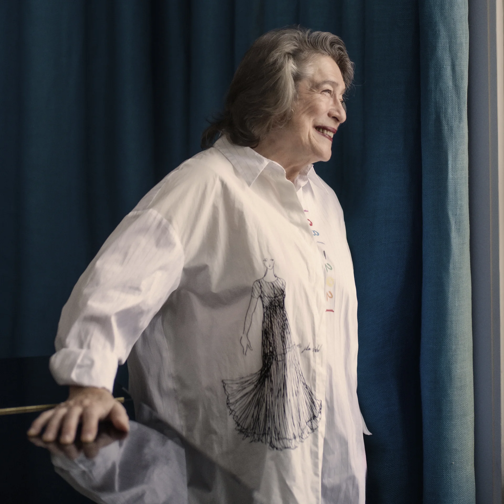 Elisabeth Leonskaja looking out a window and smiling
