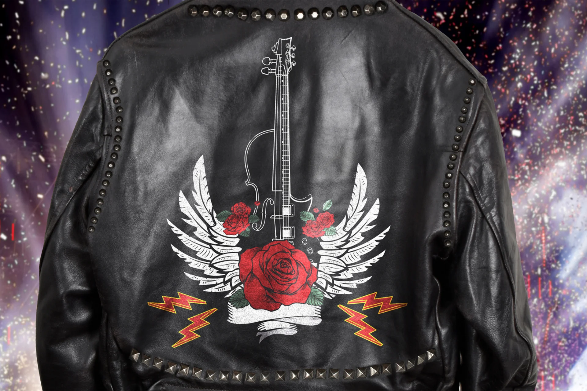 A black leather jacket with a violin - designed as a rock guitar - with classic rock-inspired roses, angle wings and lightning bolts
