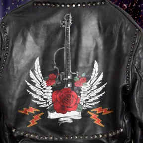A black leather jacket with a violin - designed as a rock guitar - with classic rock-inspired roses, angle wings and lightning bolts