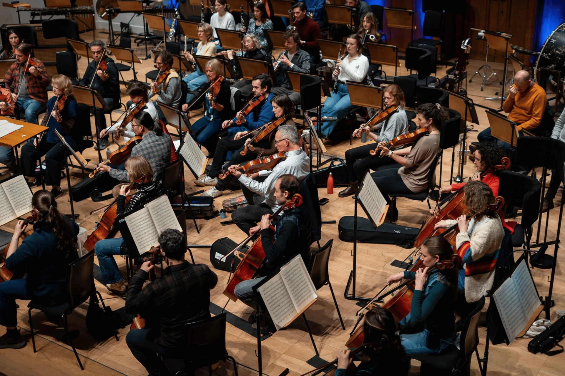 An overhead image of the string and wind section of the Royal Philharmonic Orchestra in rehearsal at Cadogan Hall