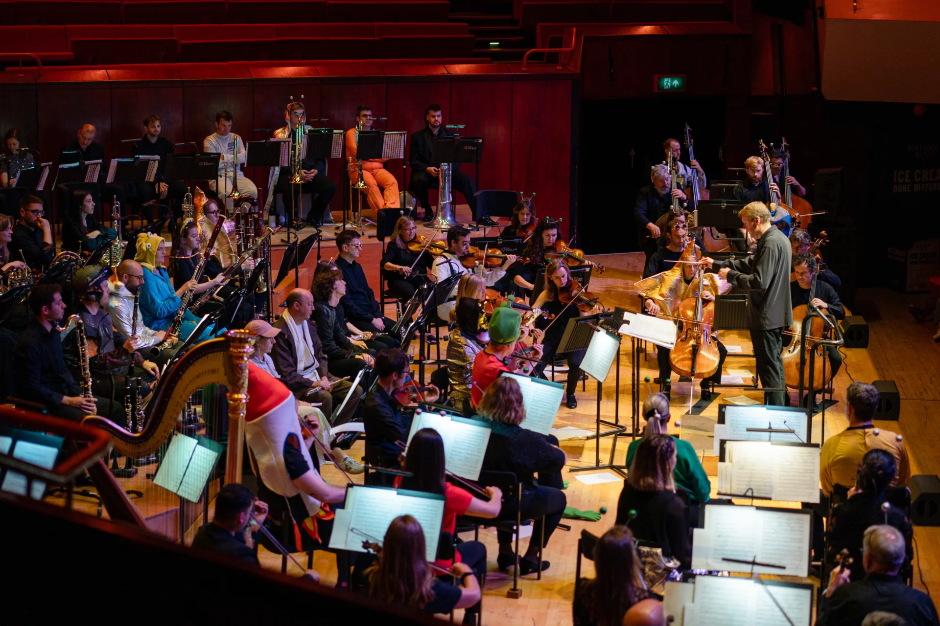 The Orchestra performing a Noisy Kids concert on stage in costumes