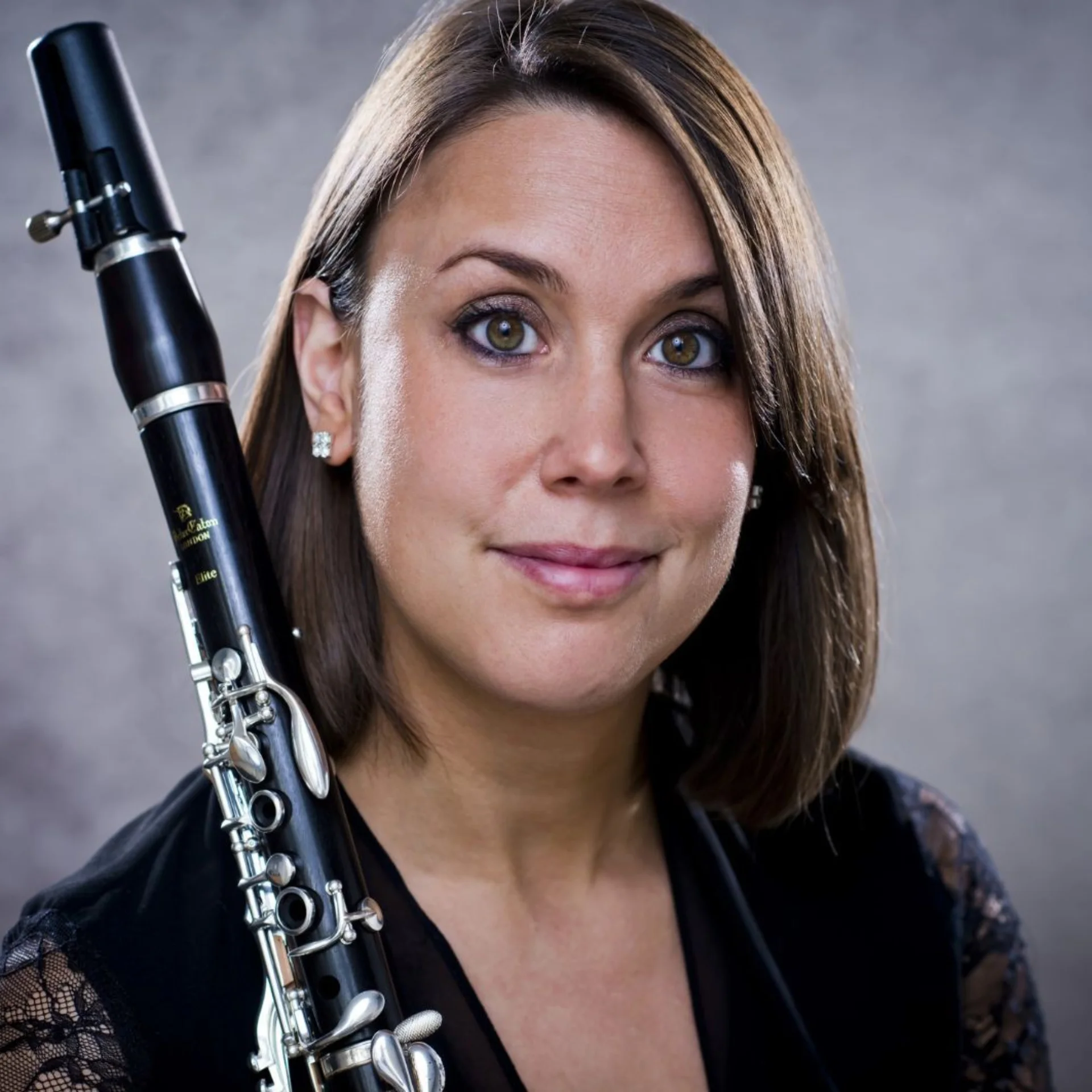 Close up of Katherine Lacy, holding her clarinet across her shoulder