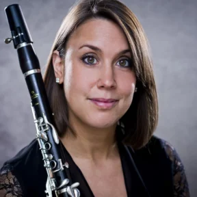 Close up of Katherine Lacy, holding her clarinet across her shoulder