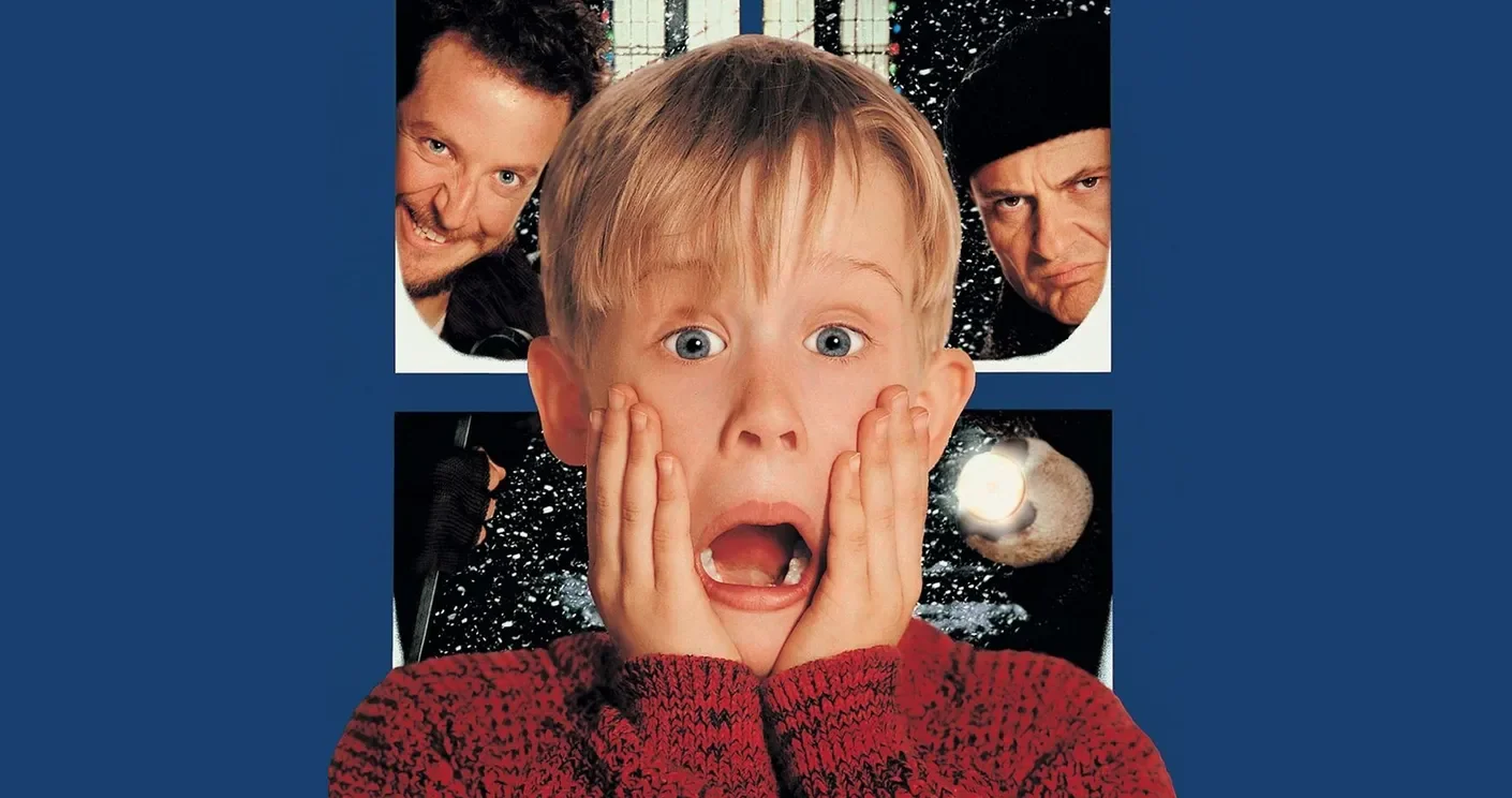 Home Alone film poster showing Kevin with a shocked expression on a blue background.