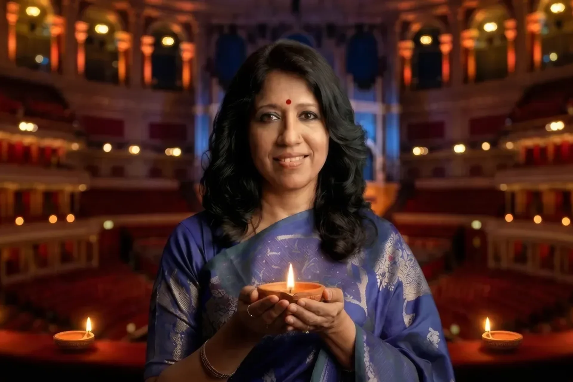 Photograph of a woman holding a candle at the Royal Albert Hall.