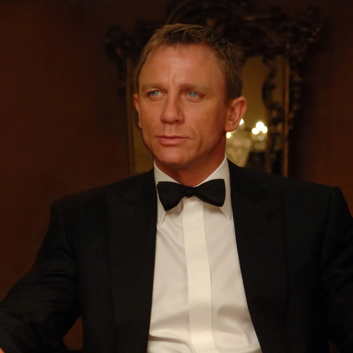 James Bond seated in a tuxedo