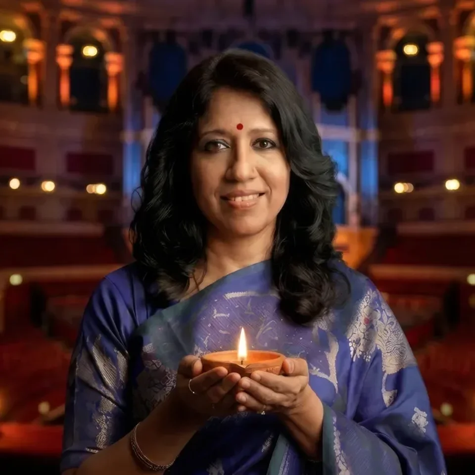 Photograph of a woman holding a candle at the Royal Albert Hall.