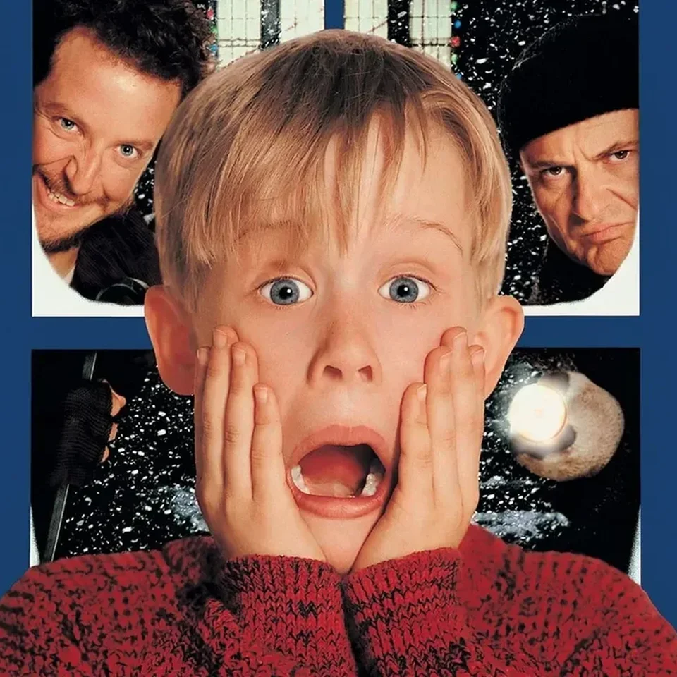 Home Alone film poster showing Kevin with a shocked expression on a blue background.