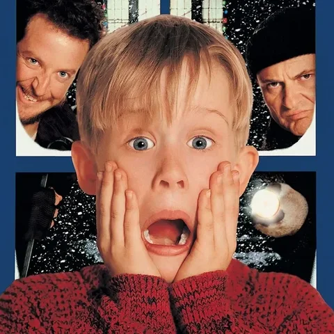 Home Alone film poster showing Kevin with a shocked expression on a blue background.