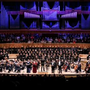 The Royal Philharmonic Concert Orchestra and a choir on stage at the Royal Festival Hall