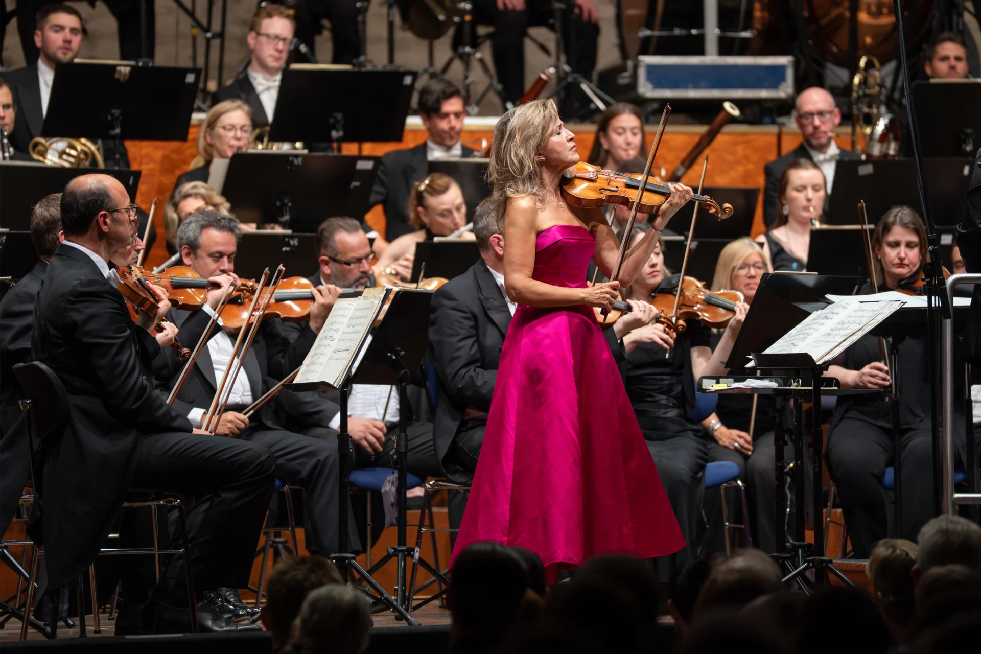 Anne-Sophie Mutter performing on stage with the Orchestra