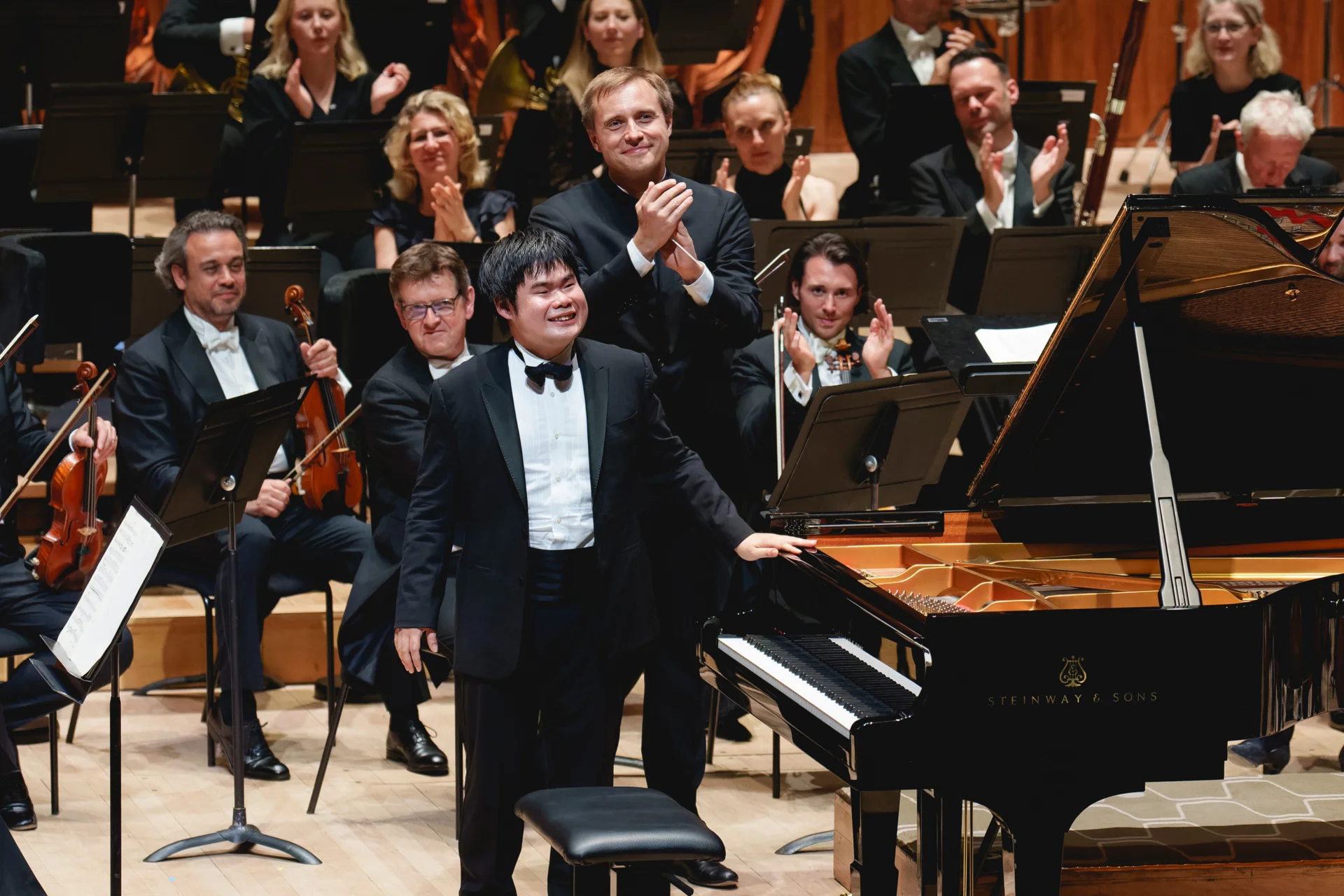 Nobuyuki Tsujii and Vasily Petrenko receiving applause on stage