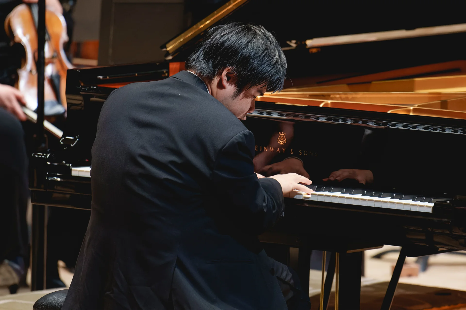 Nobuyuki Tsujii playing the piano on stage