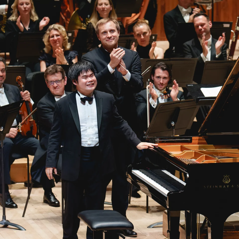 Nobuyuki Tsujii and Vasily Petrenko receiving applause on stage