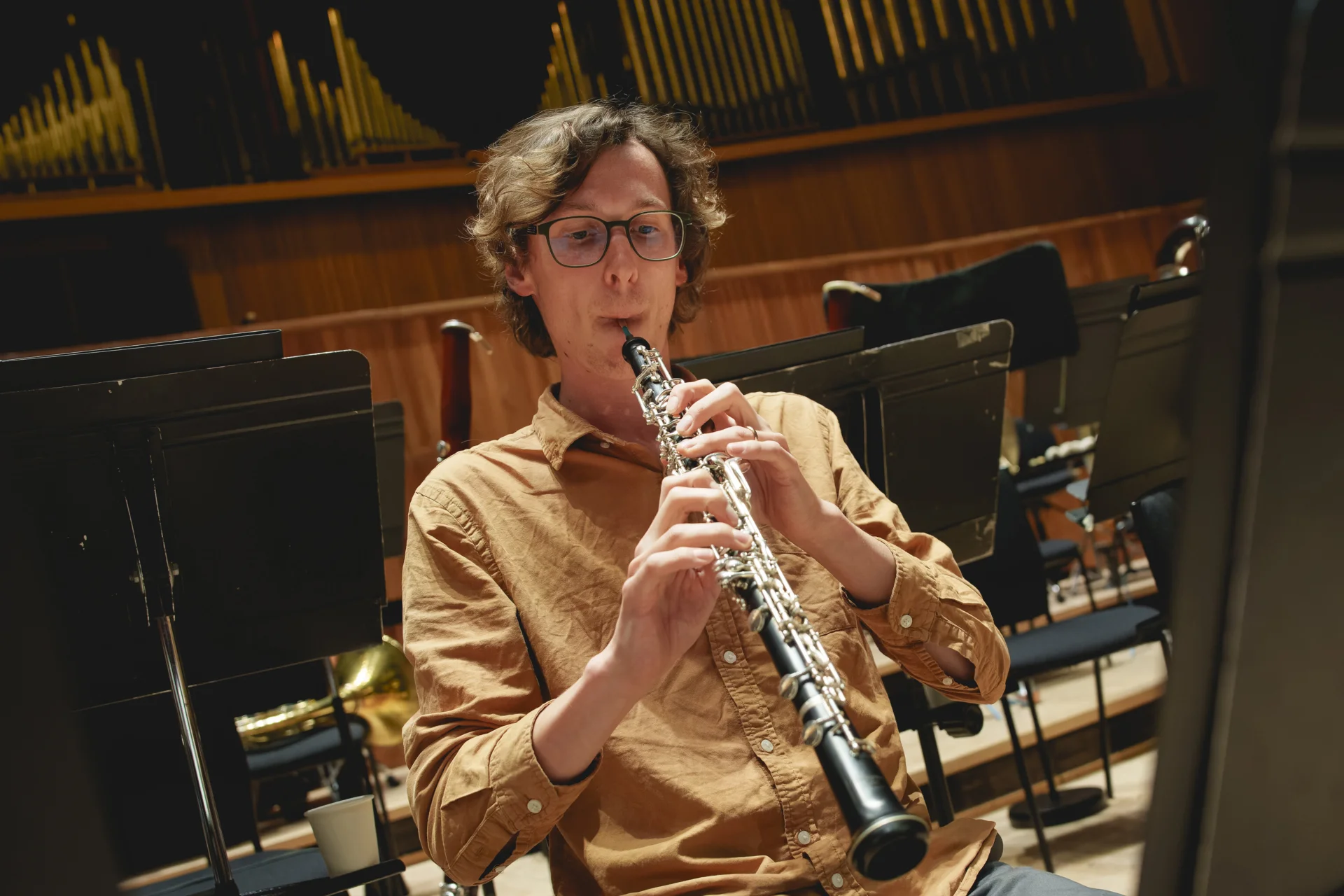 John Roberts playing the oboe in rehearsal