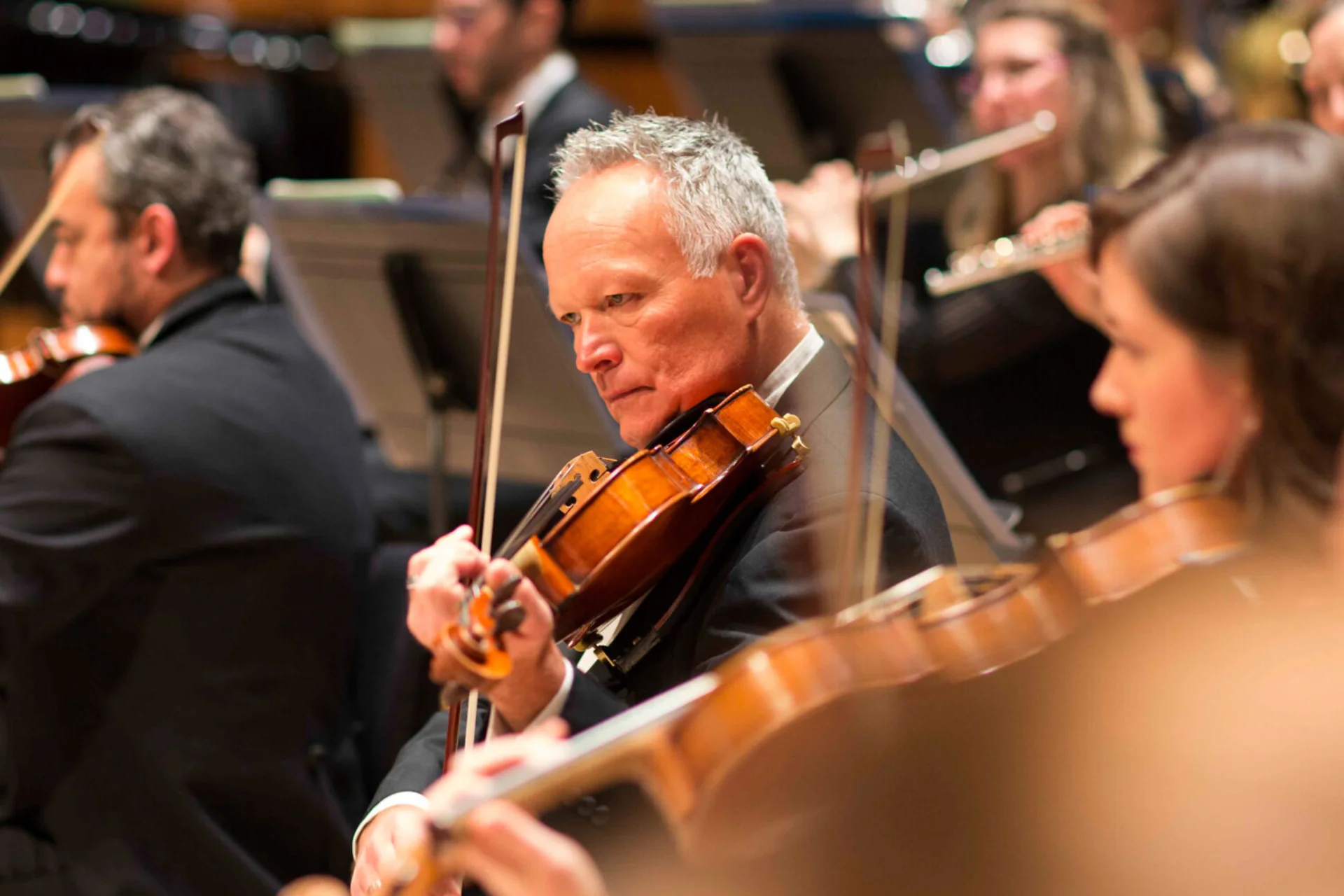 Jonathan Hallet playing viola in orchestra