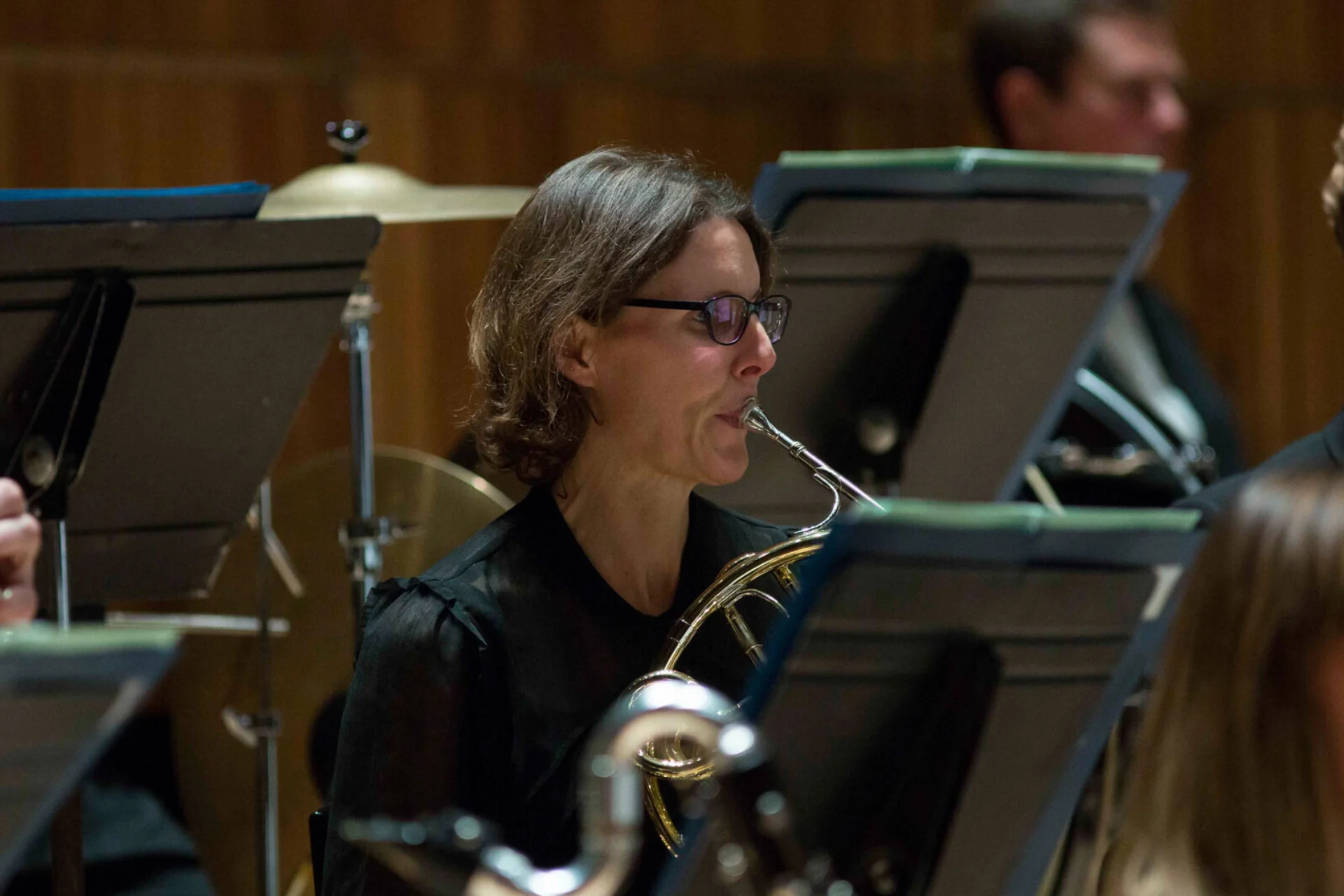 Kathryn Saunders playing horn in black top